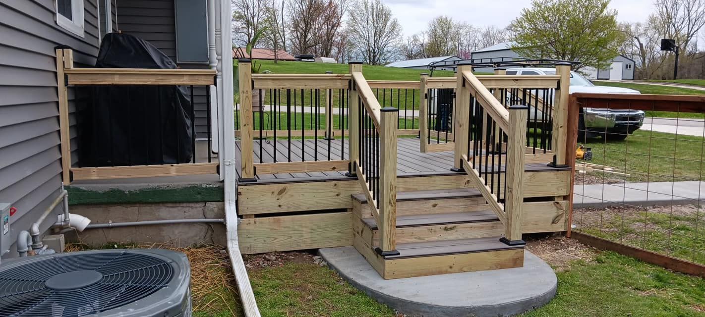 A wooden deck with stairs next to a house and an air conditioner.