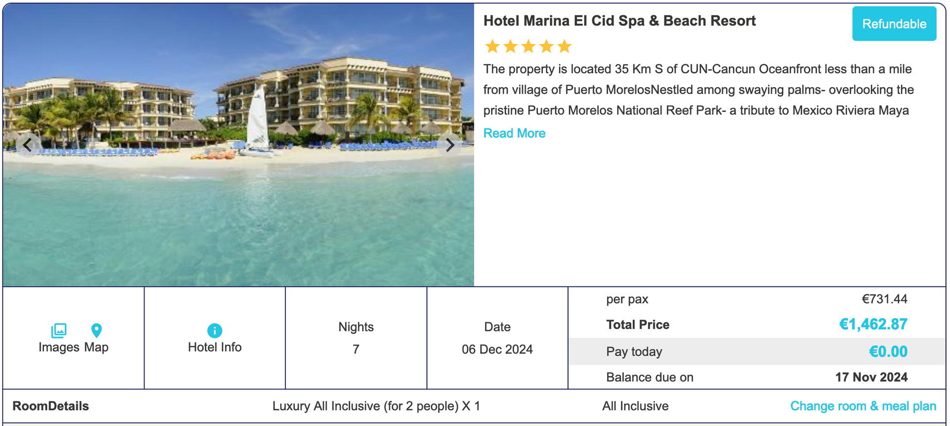 A picture of a beach with a hotel in the background