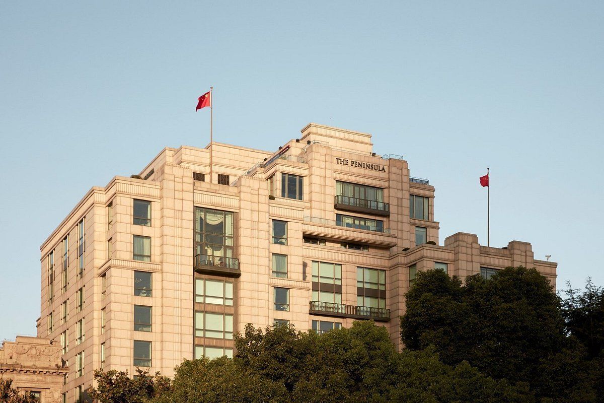 A large building with a red flag on top of it