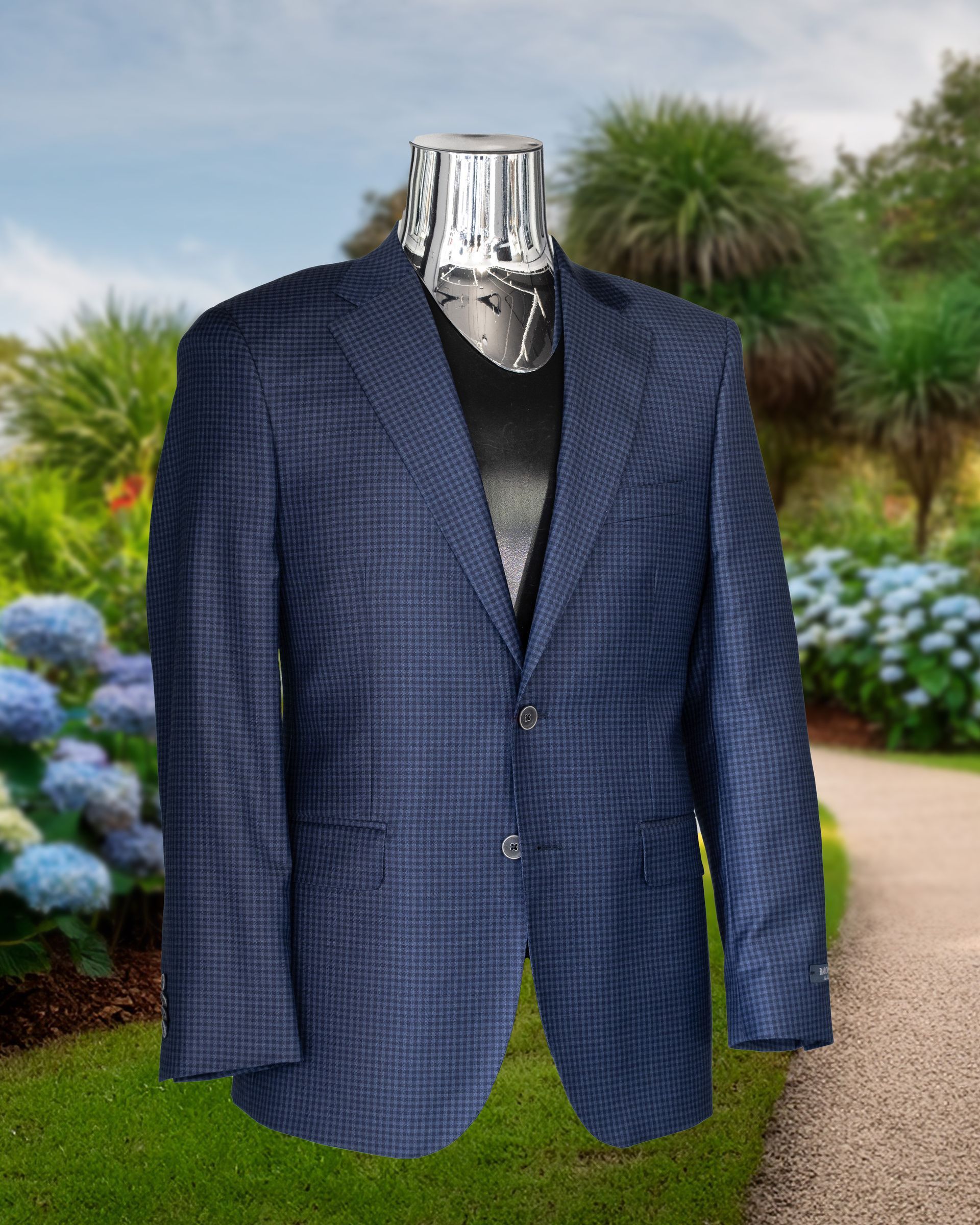 Blue checkered blazer on a headless mannequin in a garden with hydrangeas.