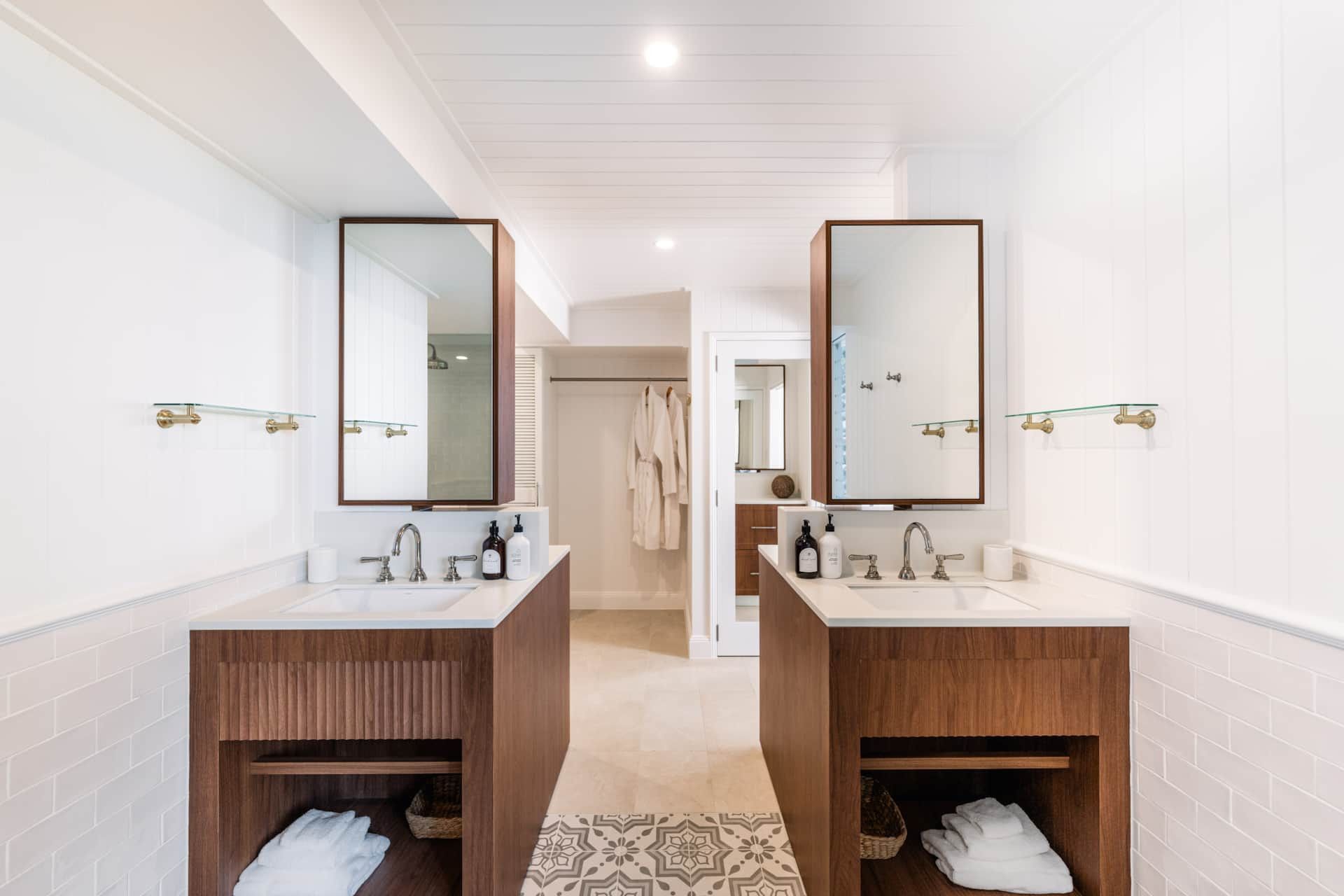 A bathroom with two sinks and two mirrors — Kitchens by CCJS in Bungalow, QLD