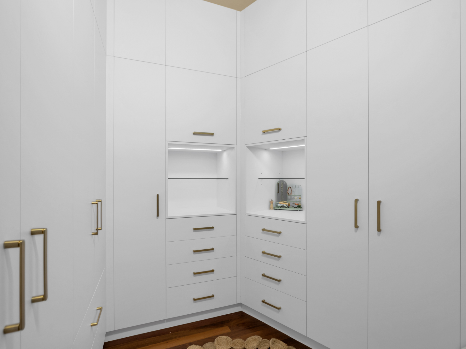 A 3d rendering of a walk in closet with white cabinets and drawers — Kitchens by CCJS in Bungalow, QLD