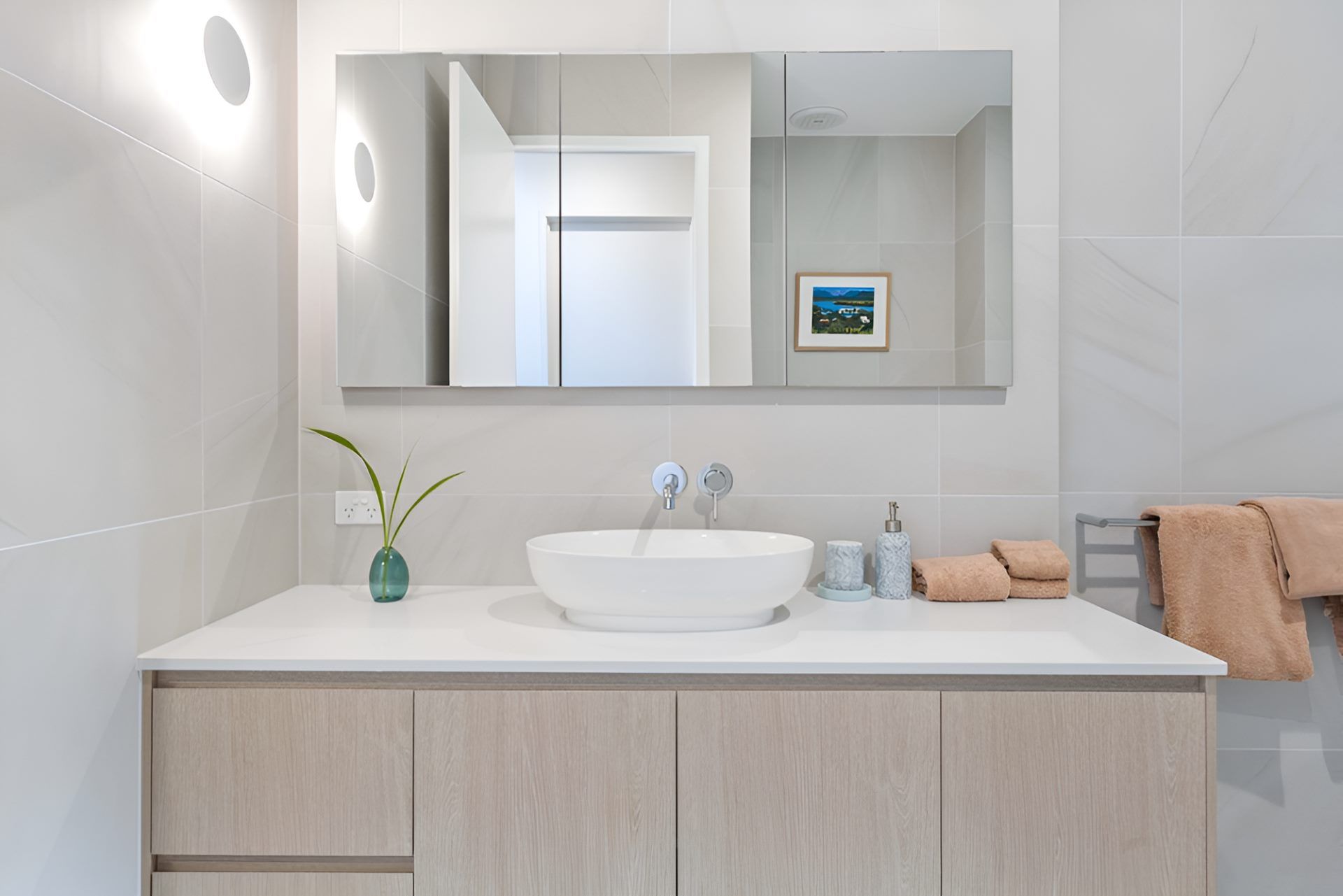 A Bathroom With a Sink, Mirror and Cabinets — Kitchens by CCJS in Bungalow, QLD