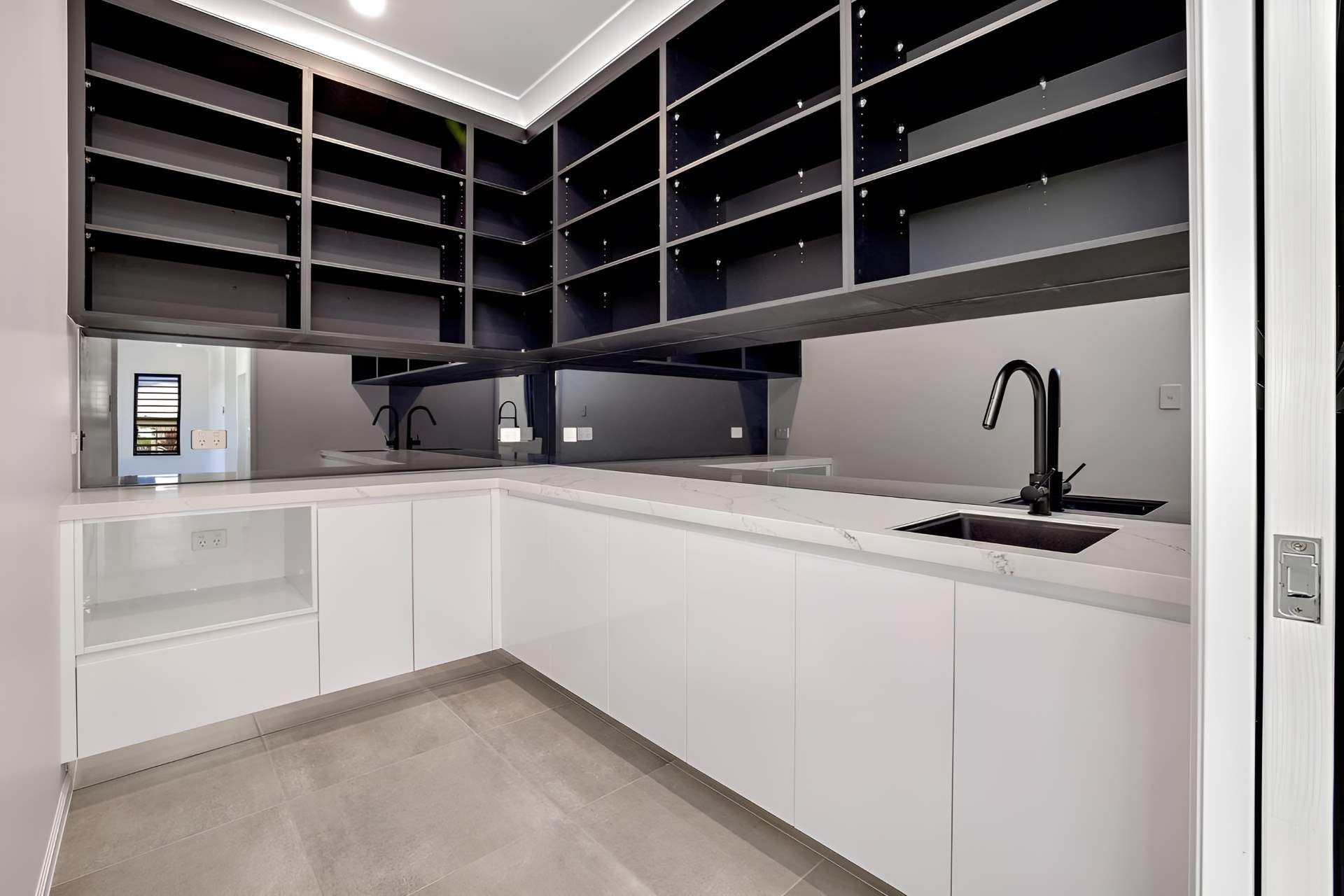 A Kitchen With White Cabinets and Black Shelves and a Sink — Kitchens by CCJS in Bungalow, QLD