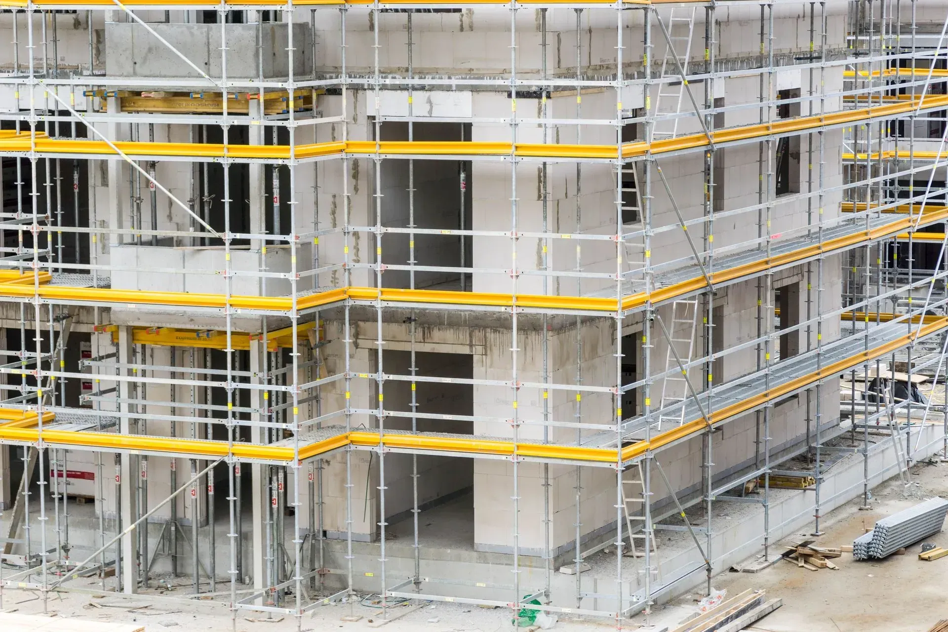 Building under construction with scaffolding wrapped — Kev's Group QLD in Kawana, QLD