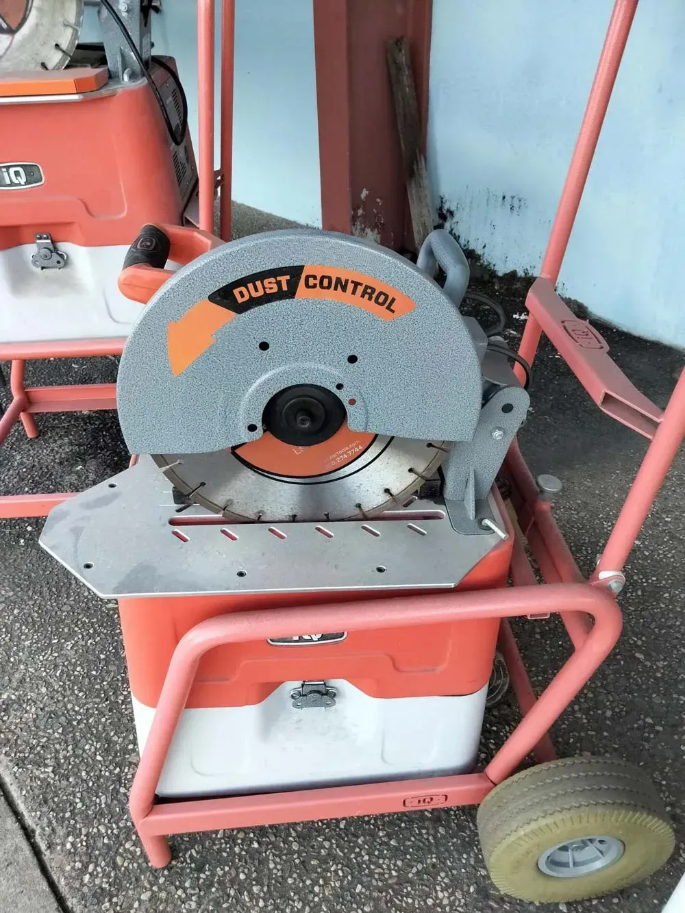 Orange and Gray Metal Cut-off Saw With Dust Control — Kev's Group QLD in Kawana, QLD