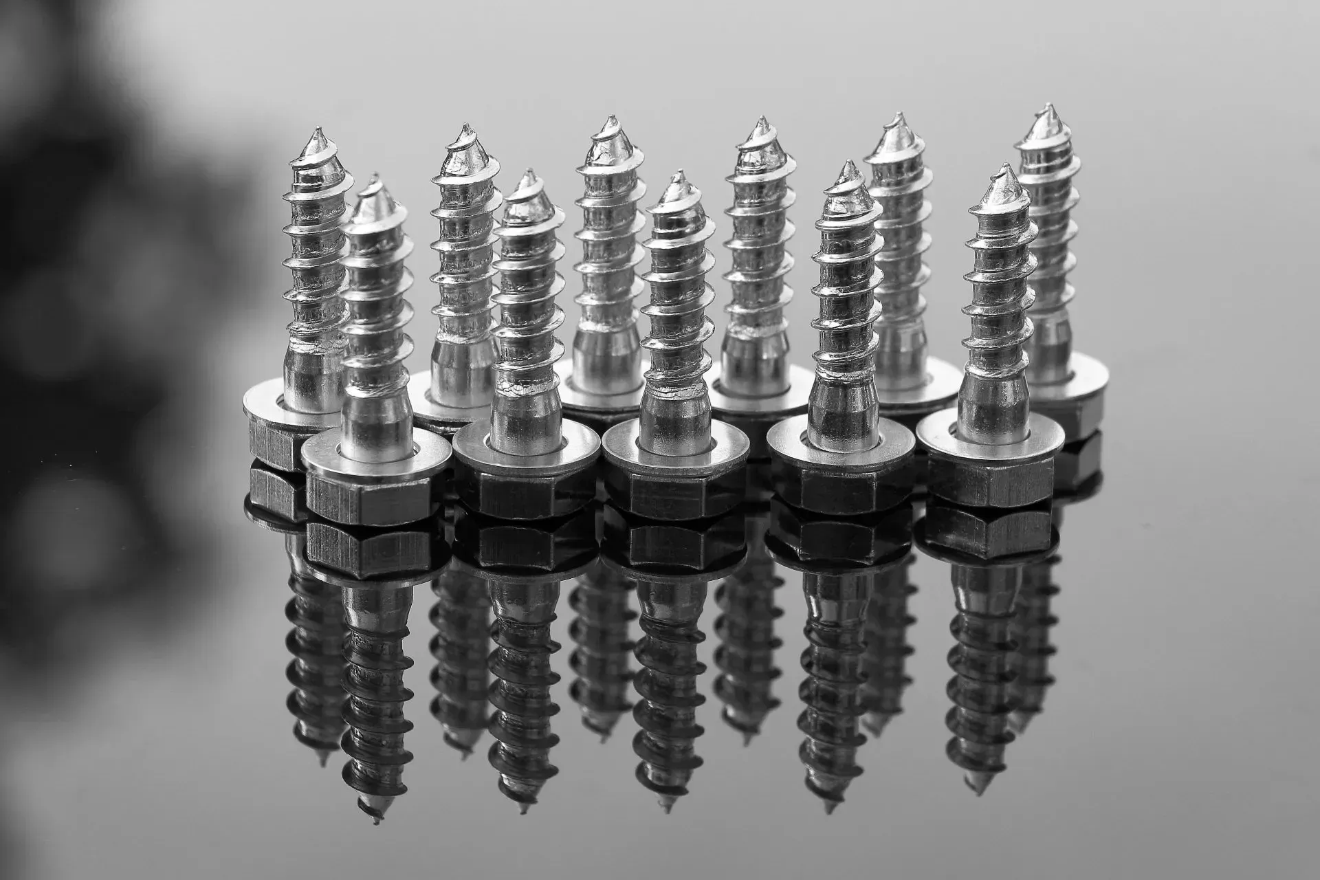 Silver Screws Standing Upright, With Reflections — Kev's Group QLD in Kawana, QLD Silver Screws Standing Upright, With Reflections — Kev's Group QLD in Kawana, QLD