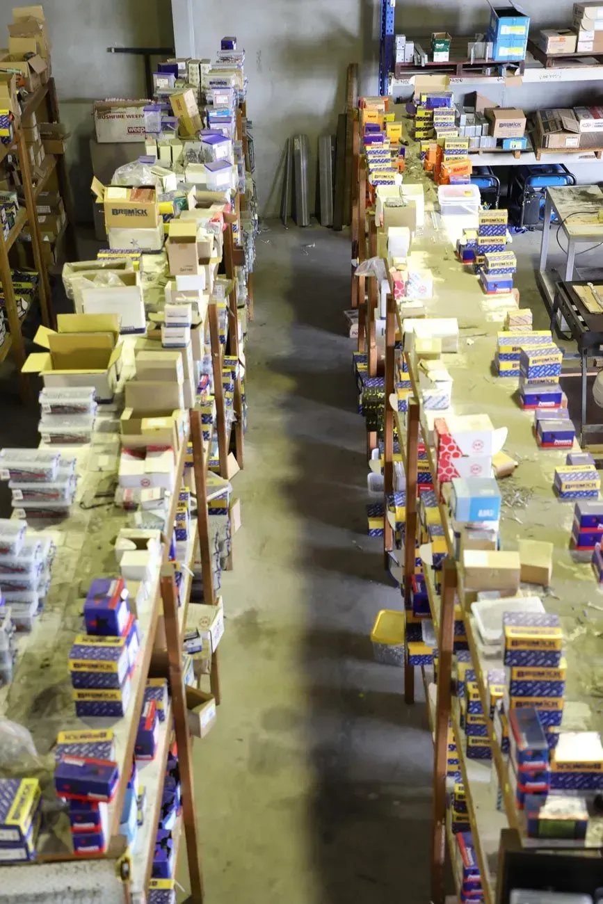 Warehouse Shelves Densely Packed With Boxes and Items — Kev's Group QLD in Kawana, QLD