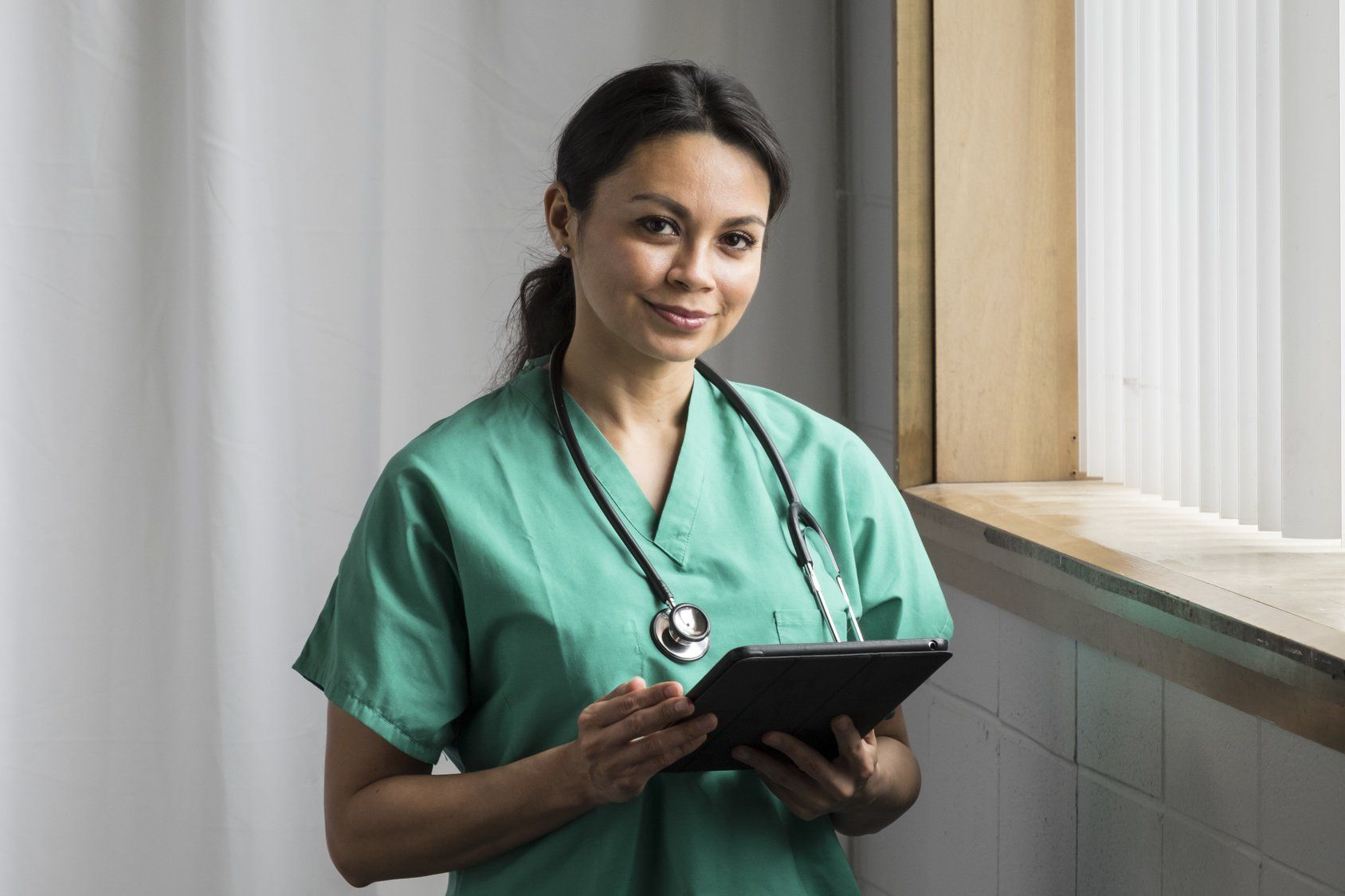 Female nurse holding a clipboard