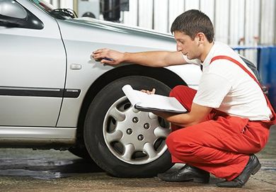 Auto Mechanic Repairman Inspecting Car —  Auto Repair in Wellsville, PA
