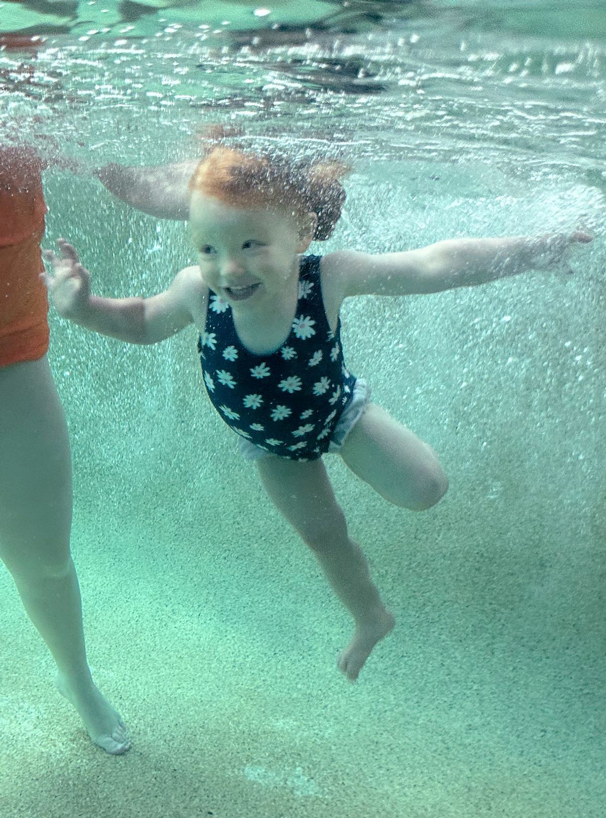 Happy toddler learning to swim at BEST Aquatics