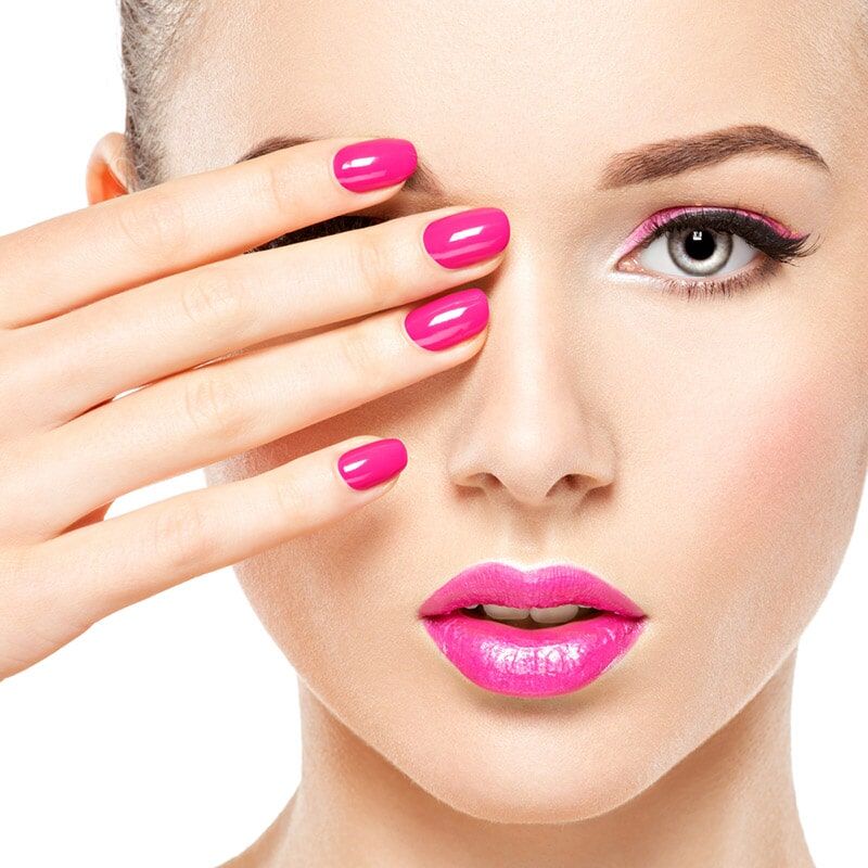 A Woman with Pink Nails and Pink lips Covering her face — Bernadette's Beauty Care in Sarina, QLD
