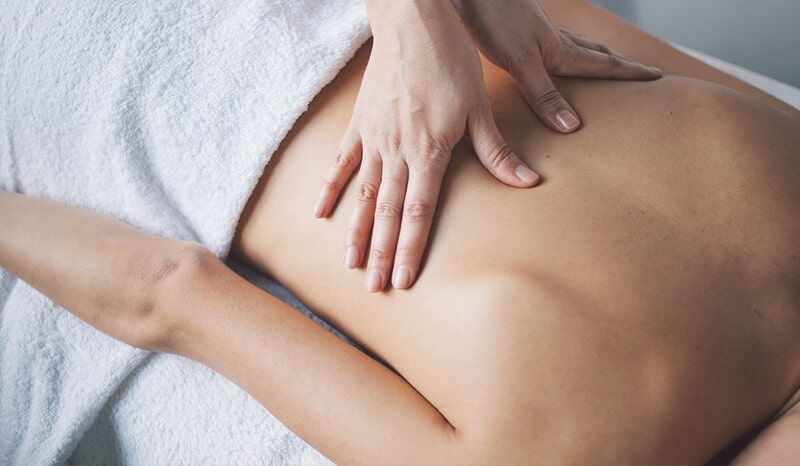 A Woman is Getting a Massage on her Back in a spa — Bernadette's Beauty Care in Sarina, QLD