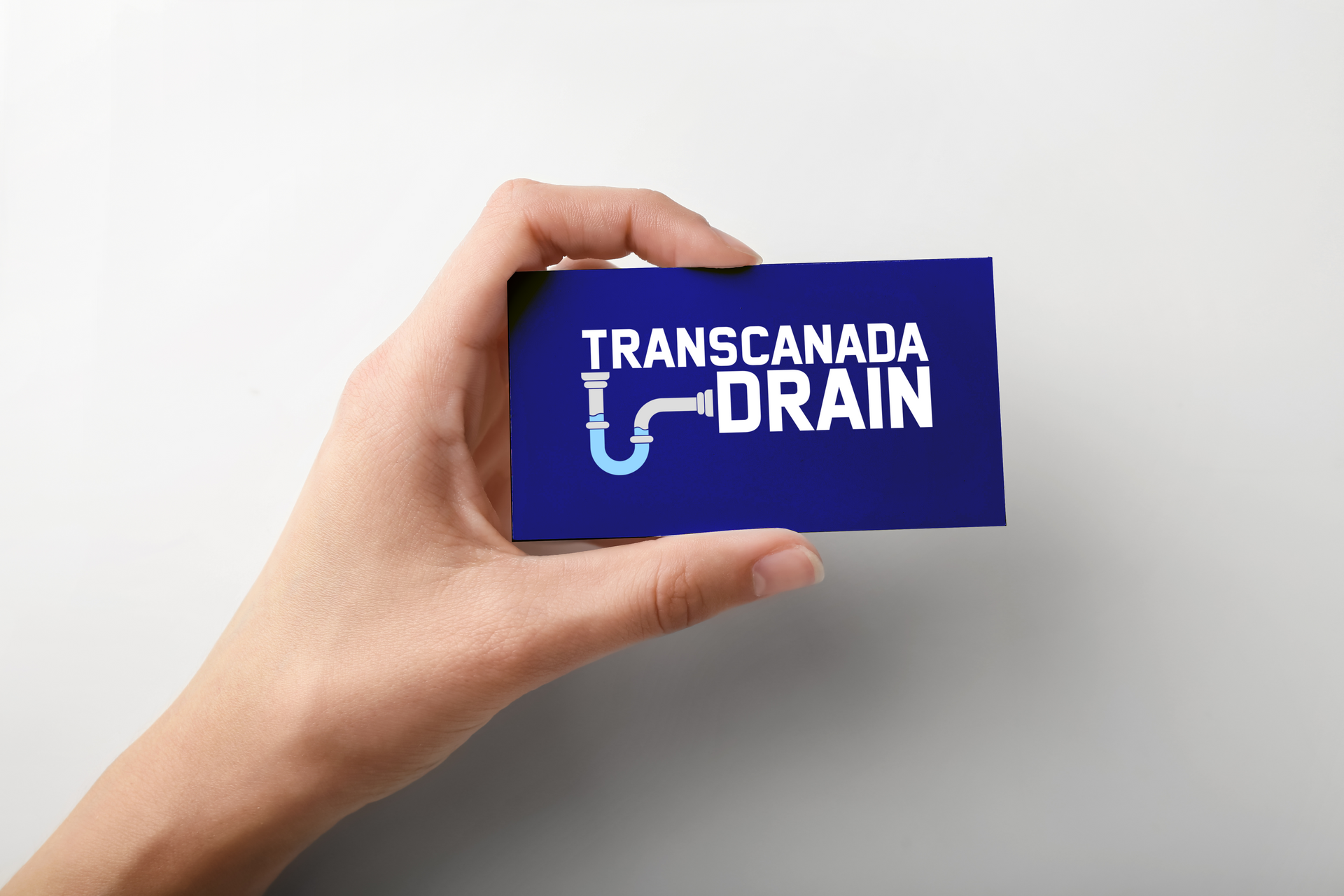 Hand holding a blue business card with 