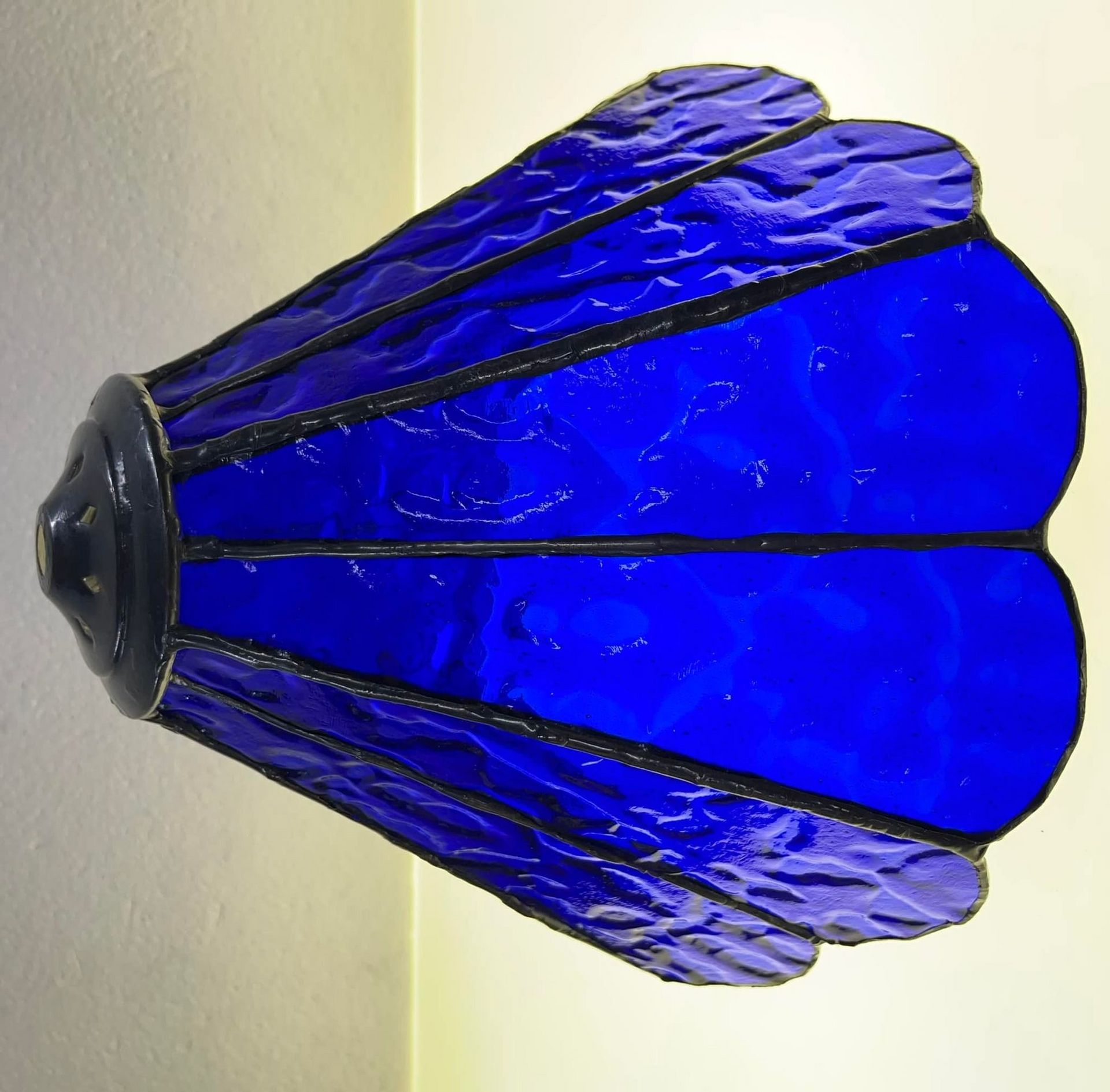 A Blue Stained Glass Lamp Shade Is Sitting On A White Surface — Townsville Stained Glass In Charters Towers, QLD
