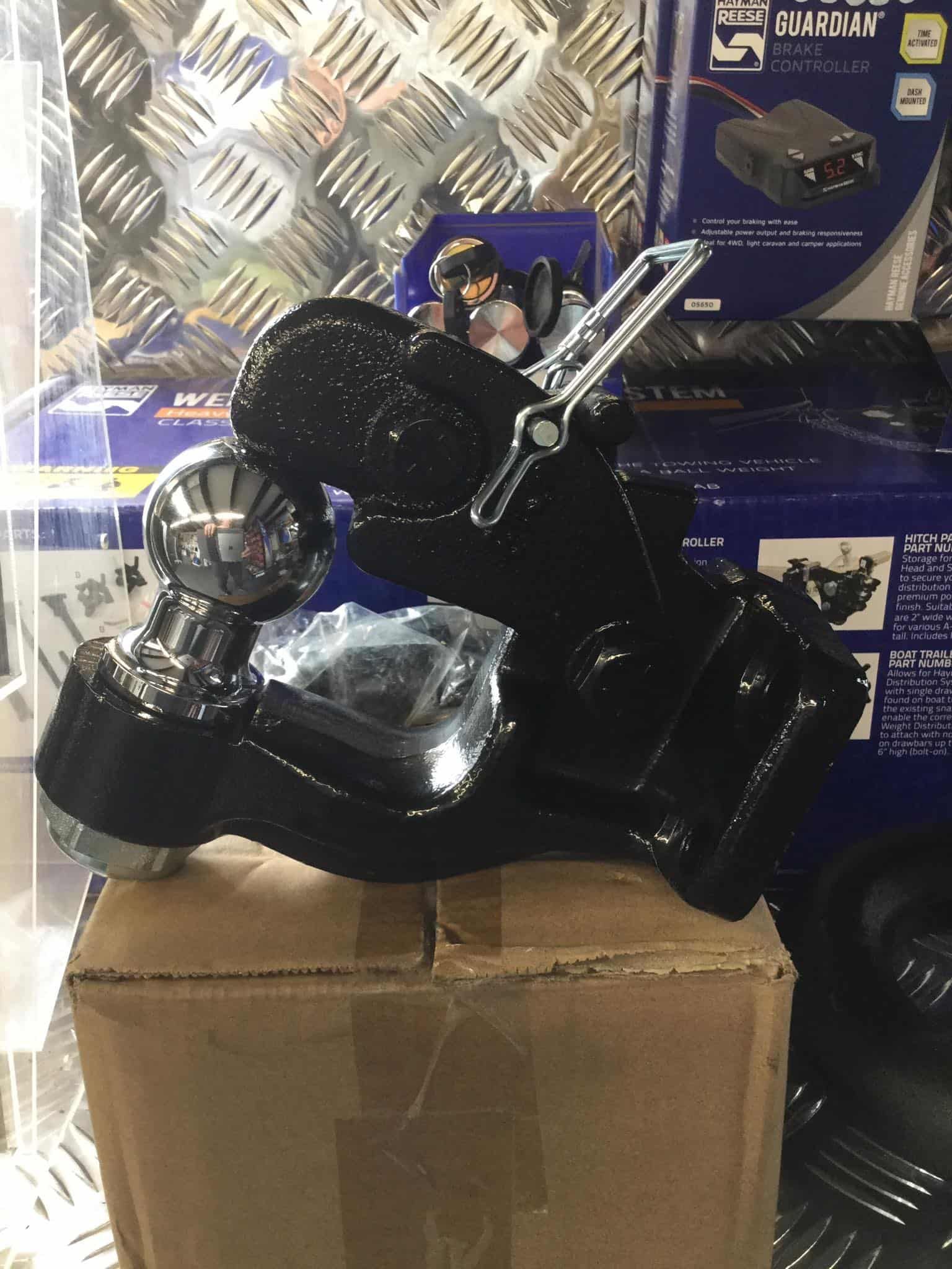 A Black Object is Sitting on Top of a Cardboard Box — B & C Caravan Service Pty Ltd In Dubbo, NSW