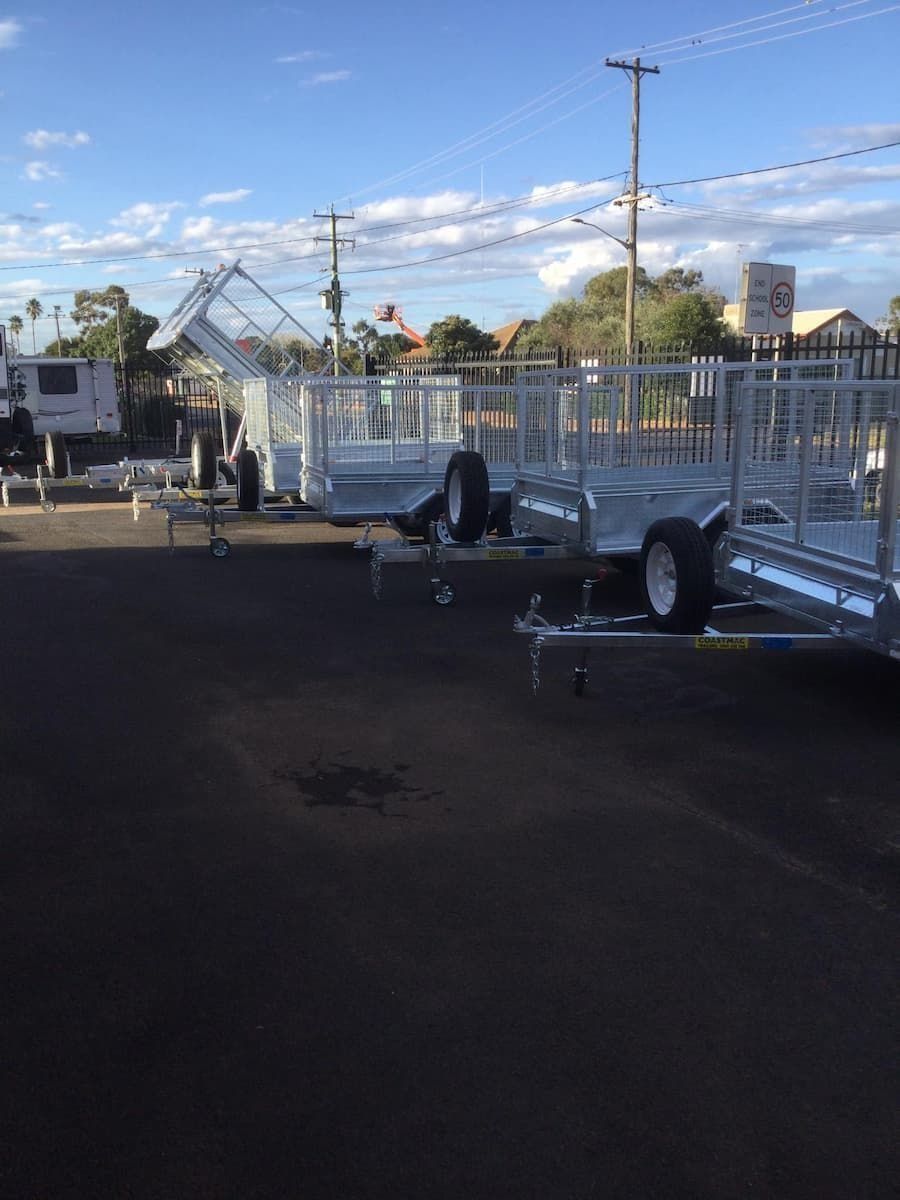 A Row of Trailers Are Parked in a Parking Lot — B & C Caravan Service Pty Ltd In Dubbo, NSW