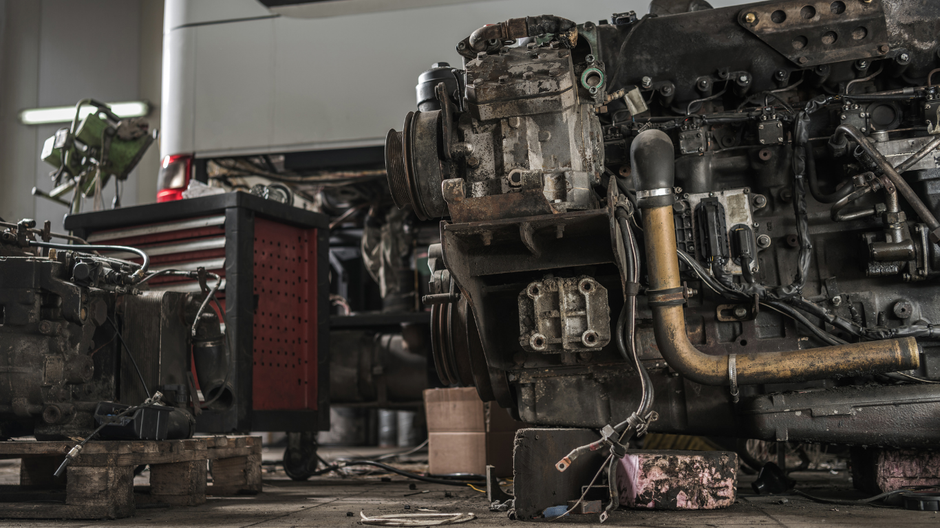 A large white yacht is being lifted by a crane