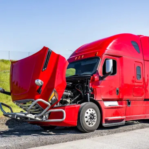 A large white yacht is being lifted by a crane