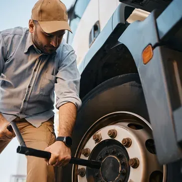 A large white yacht is being lifted by a crane