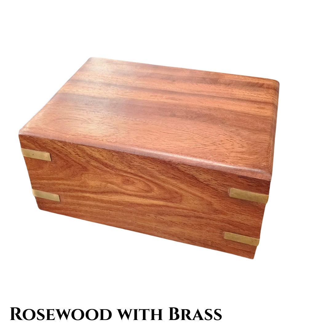 Brown rosewood box smaller than a shoebox with brass paw prints on top and brass accents on the corners.