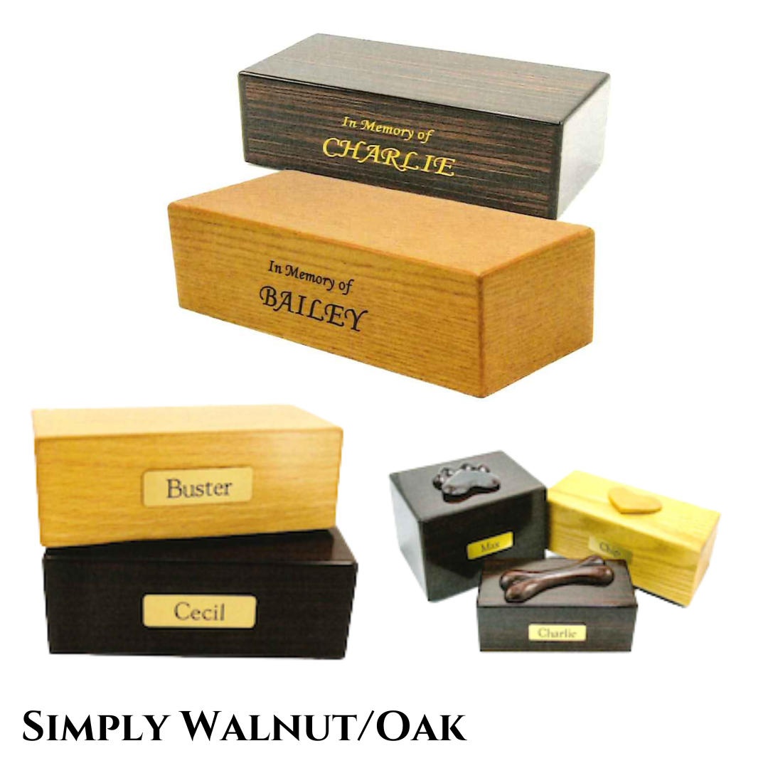 Multiple simple, but beautiful, wood urns with little or no adornment except for engraving or small brass nameplates.