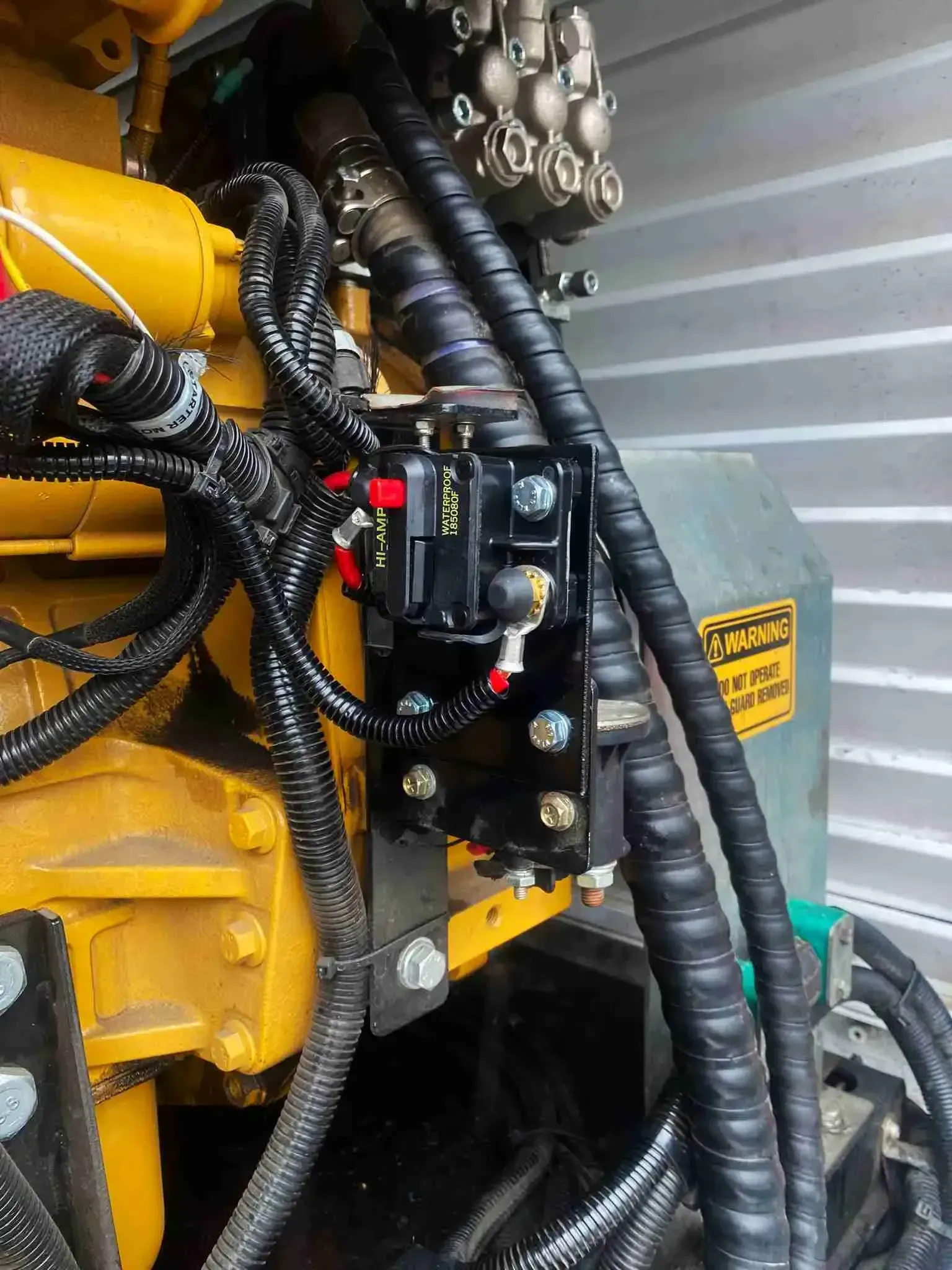 A close up of a machine with a lot of wires coming out of it.