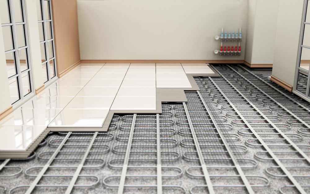 Room under construction with tile flooring partially installed over exposed radiant heating tubes — Southern Trade Services in Warburton, VIC