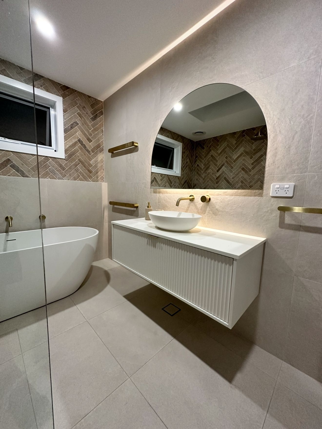 A Wooden Deck With A Glass Railing Overlooking A Swimming Pool — Penman Projects In Salamander Bay, NSW