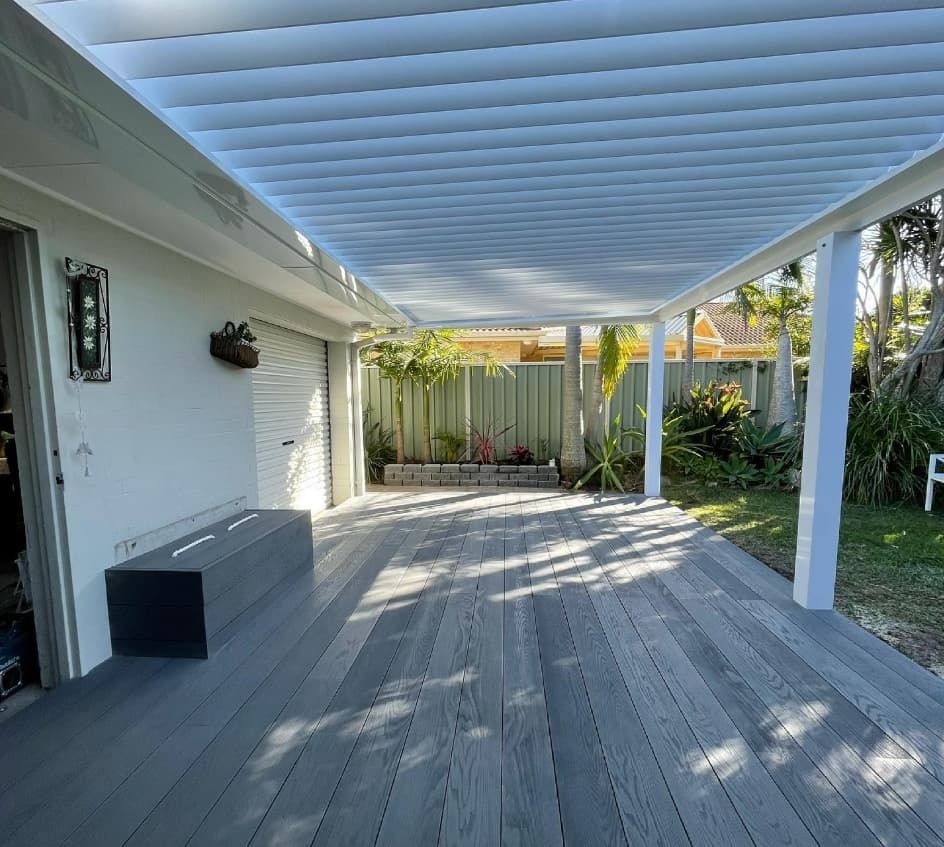 A Wooden Deck With A White Pergola Over It — Penman Projects In Salamander Bay, NSW