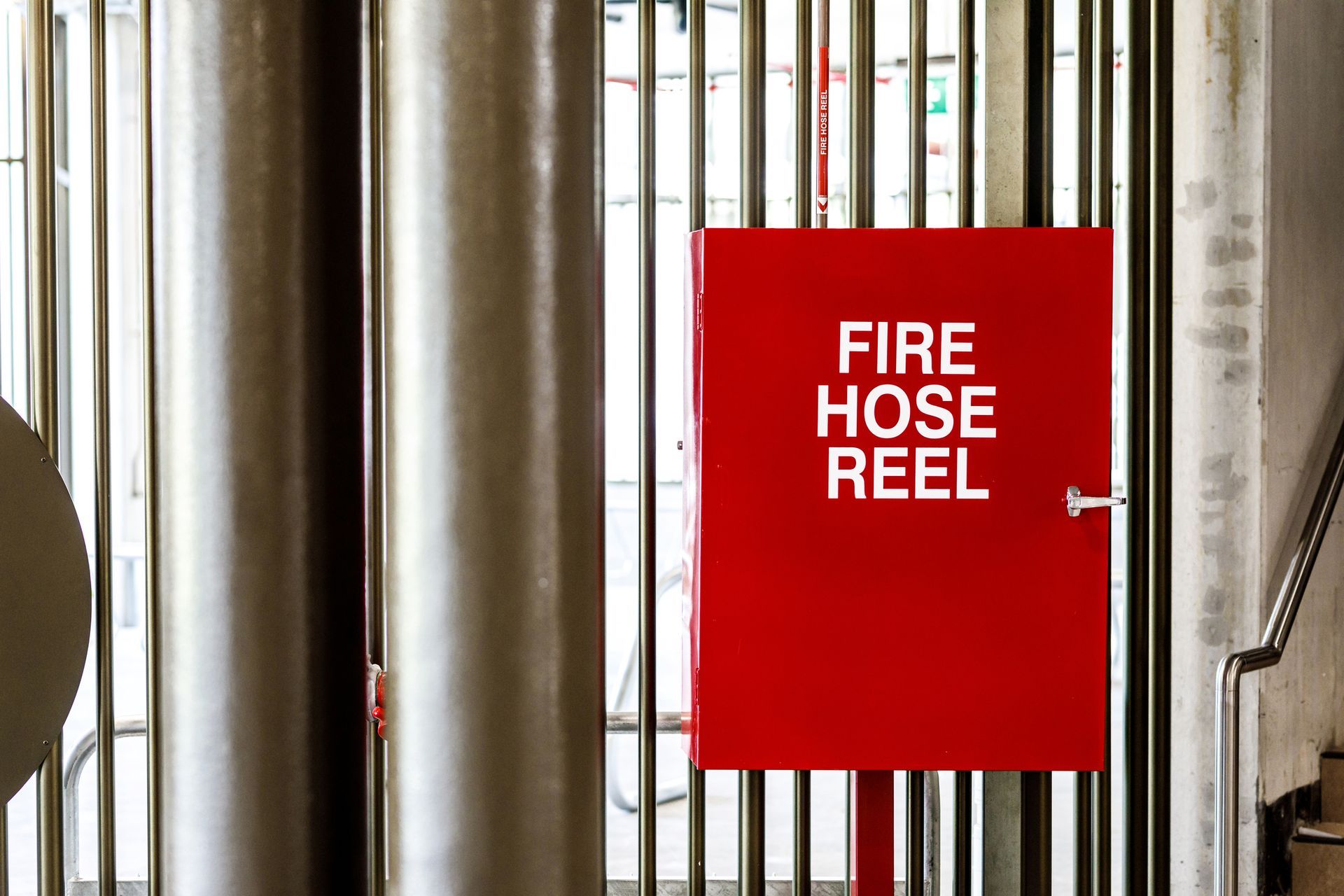 A sign and cupboard for a fire hose— Frank Plumbing In Delacombe, VIC