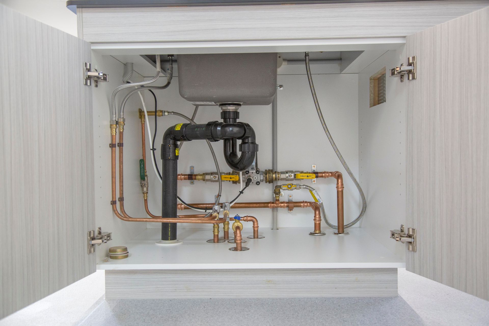 A Excavator Is Digging A Hole In The Ground — Frank Plumbing In Delacombe, VIC