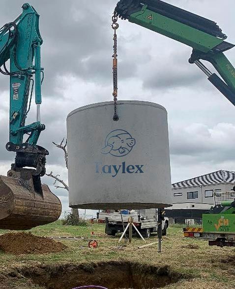 A septic tank being lifted by a crane — Frank Plumbing In Delacombe, VIC