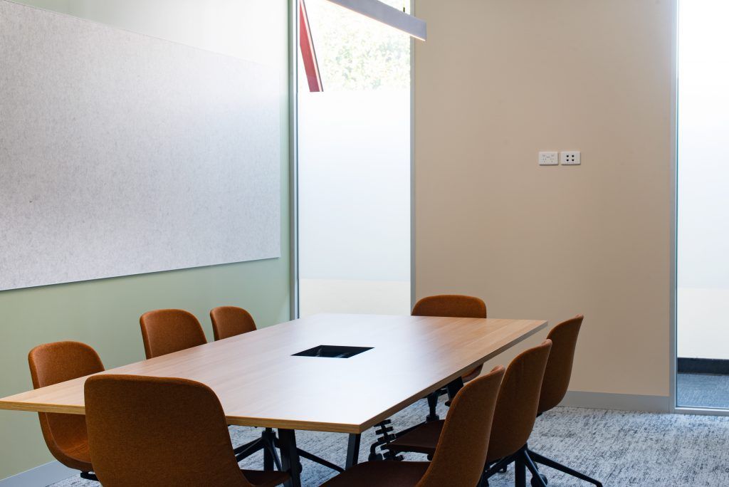 A Conference Room With A Long Table And Chairs — Frank Plumbing In Delacombe, VIC