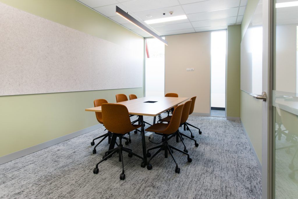 A Conference Room With A Long Table And Chairs — Frank Plumbing In Delacombe, VIC