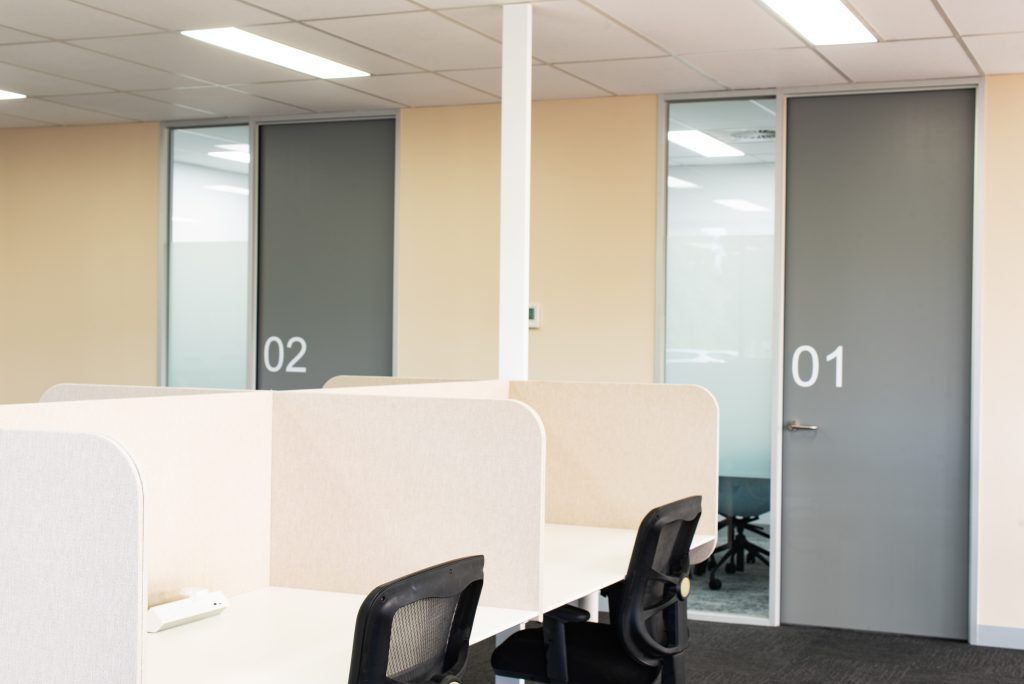 A Cubicle In An Office With A Door That Says ' 01 ' On It — Frank Plumbing In Delacombe, VIC