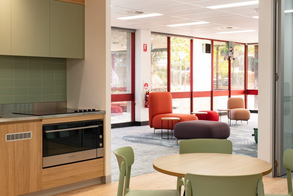 There Is A Table And Chairs In The Middle Of The Room — Frank Plumbing In Delacombe, VIC