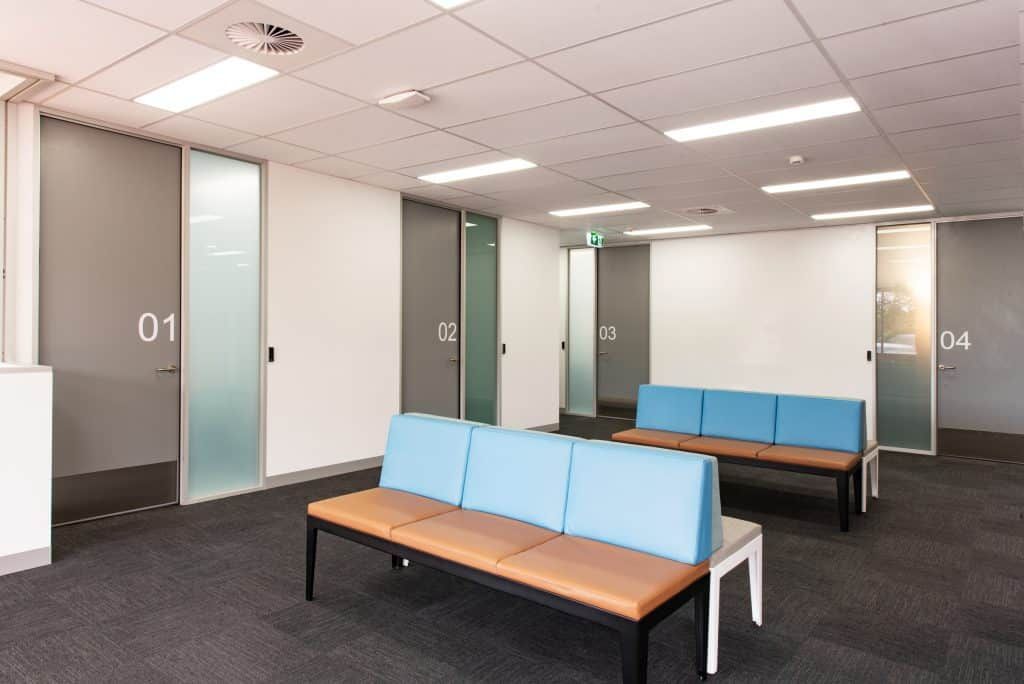 A Waiting Room With A Blue Couch And A Brown Couch — Frank Plumbing In Delacombe, VIC