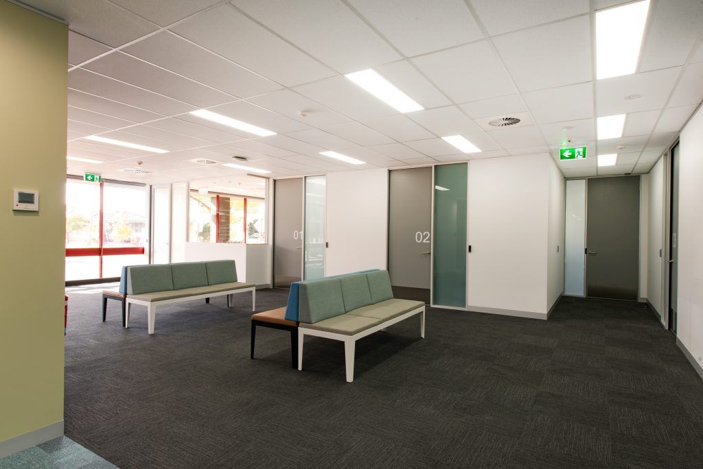 A Waiting Room With A Couch And Chairs In It — Frank Plumbing In Delacombe, VIC