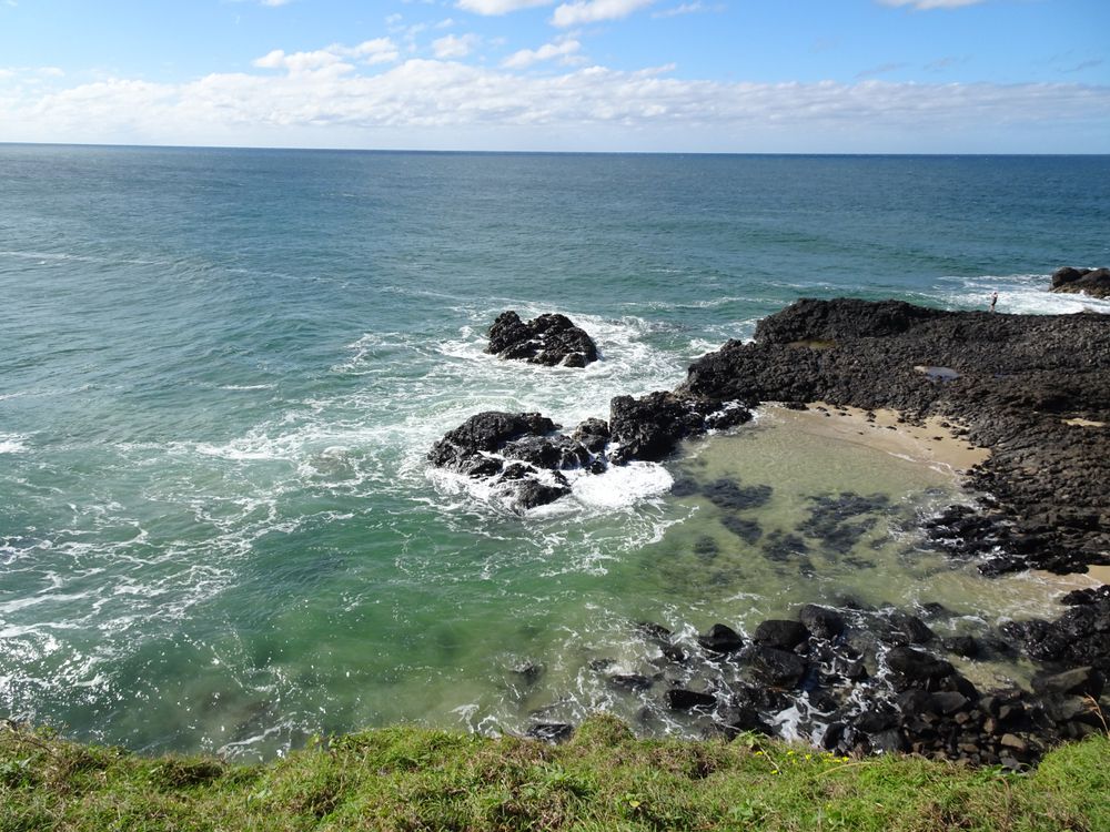 A View of the Ocean From a Cliff With Rocks in the Foreground — Tallow Tree Services Pty Ltd in Lennox Head, NSW