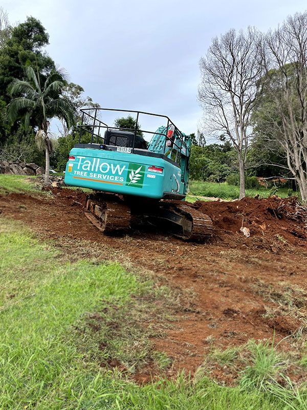 Excavator Traverses a Dusty Track With Expertise — Tallow Tree Services Pty Ltd in Bangalow, NSW