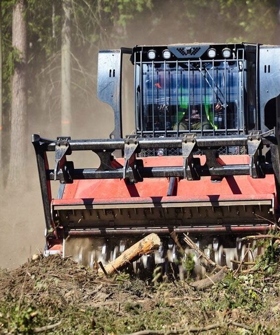 Forest-clearing Tractor in Action, Efficiently Cutting Down Trees — Tallow Tree Services Pty Ltd in Bangalow, NSW
