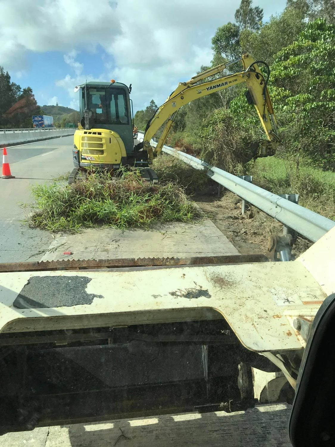Removing Grass On The Side Of The Road