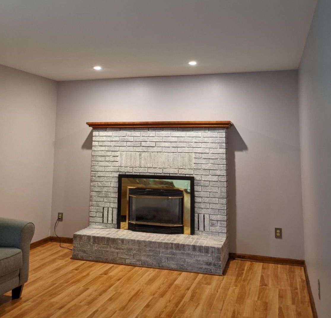 There is a fireplace in the middle of the room.