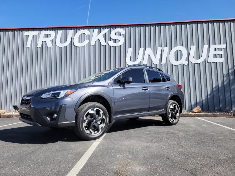 A Subaru XV in Front of Trucks Unique in Albuquerque, NM