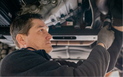 Mechanic Checking Suspension in Albuquerque, NM - Trucks Unique