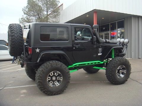 A Black Jeep With Green Struts in Albuquerque, NM - Trucks Unique