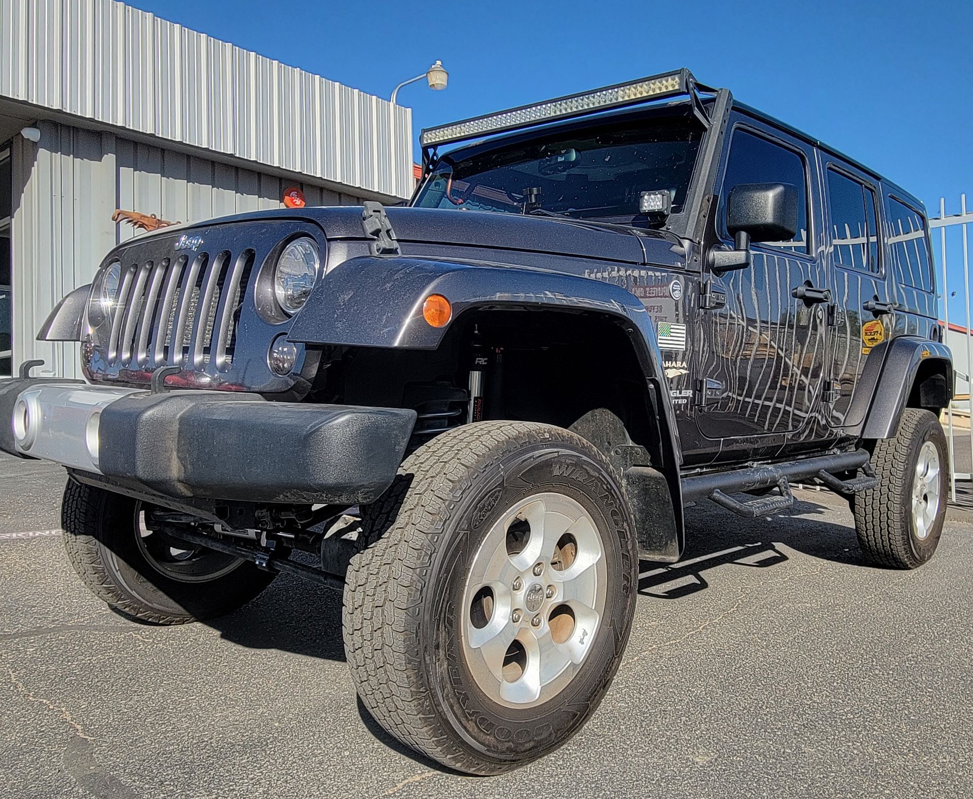 Jeep Parked in Front of Trucks Unique in Albuquerque, NM