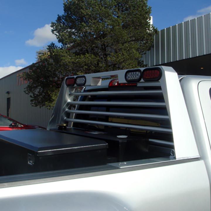 A Silver Truck With a Grille on the Back of it - Truck Unique