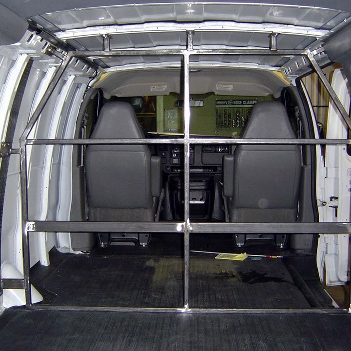 The Inside of a Van With a Metal Railing Between the Seats - Truck Unique